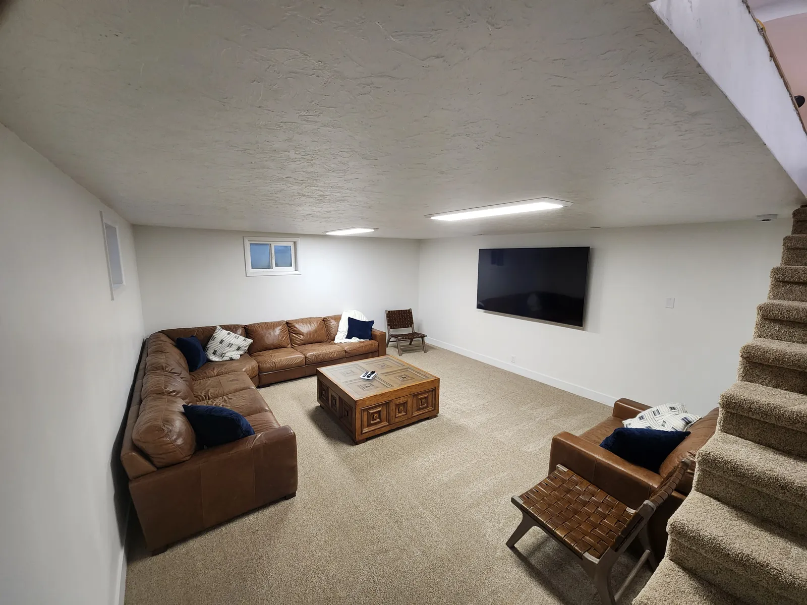 Finished basement family room with sectional sofa